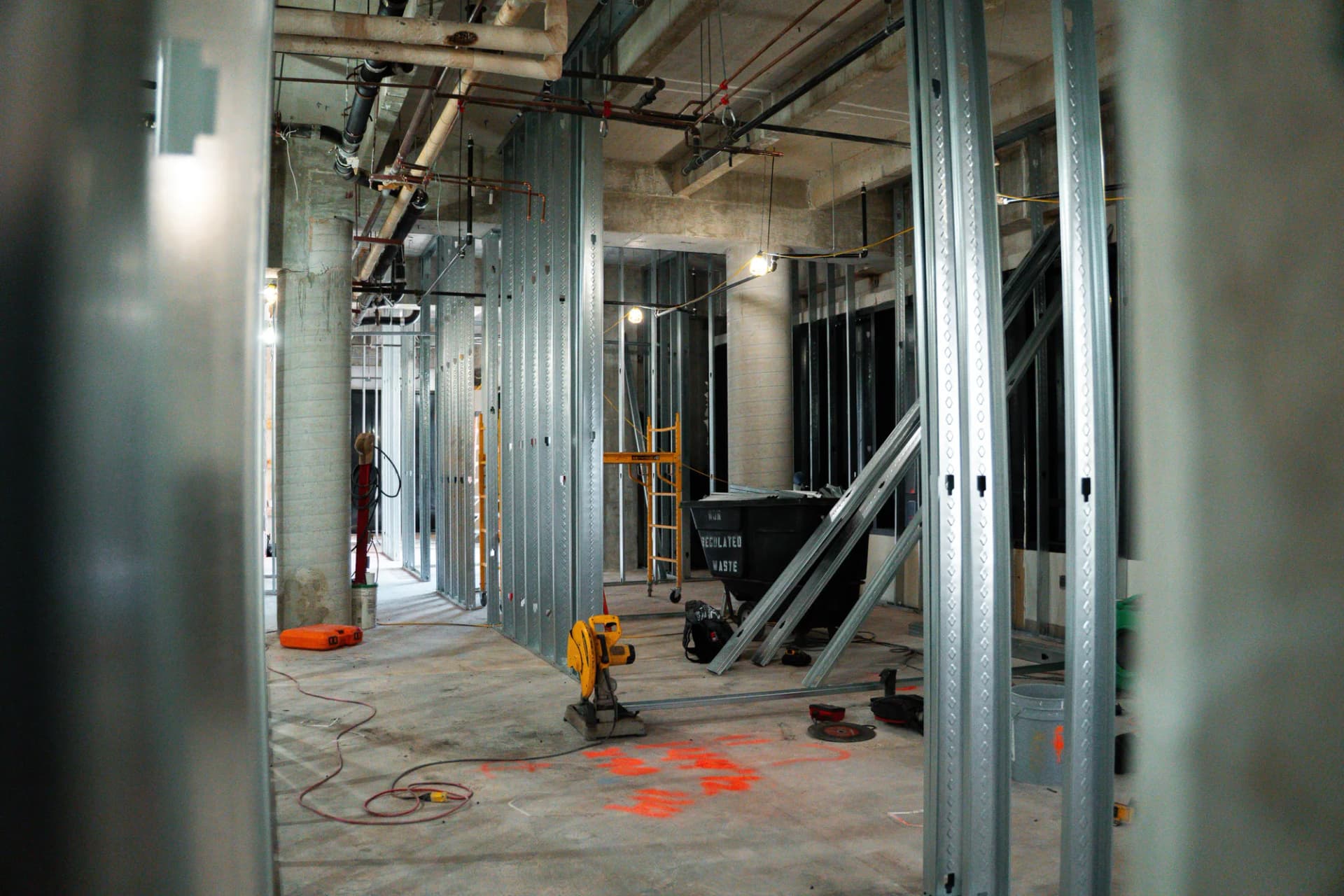 Metal-stud corridor and overhead building services at Bascom Palmer